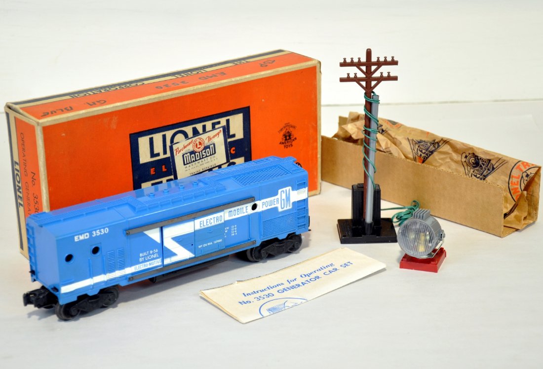 Mint Boxed Lionel 3530 Generator Car: Clean, bright & unrun car with long stripe. Black base pole is intact with wrapping. It has its instructions & insert with a C8 ob, car C9+