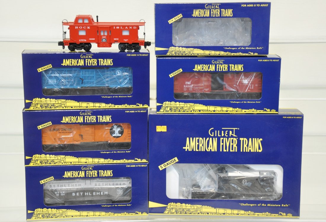 6 Lionel American Flyer Freight Cars: S Gauge. Includes 49012 SF crane; 48722 RI caboose; 48366 JC boxcar; 48378 IC boxcar; 48379 GN stock car; 48554 Bethlehem coil car. All are new in boxes, C10