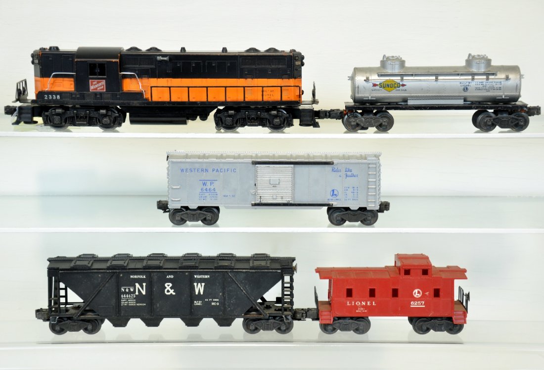 5Pc Lionel Diesel Freight Set: Includes a 2338 MR GP-7 diesel, screw support missing 1 end, so cab is loose; 6464-1 WP boxcar, type I; 6465 tank car; 6446-25 cement car; 6257 caboose. All show moderate playwear, C5+-6
