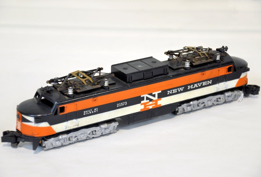 American Flyer 21573 NH EP-5 Electric: S Gauge. Nice EP5 showing light to moderate playwear. It is missing 1 pantograph spring and has surface oxidation on pantographs. The cowls are intact and should clean up nicely, otherwise C6