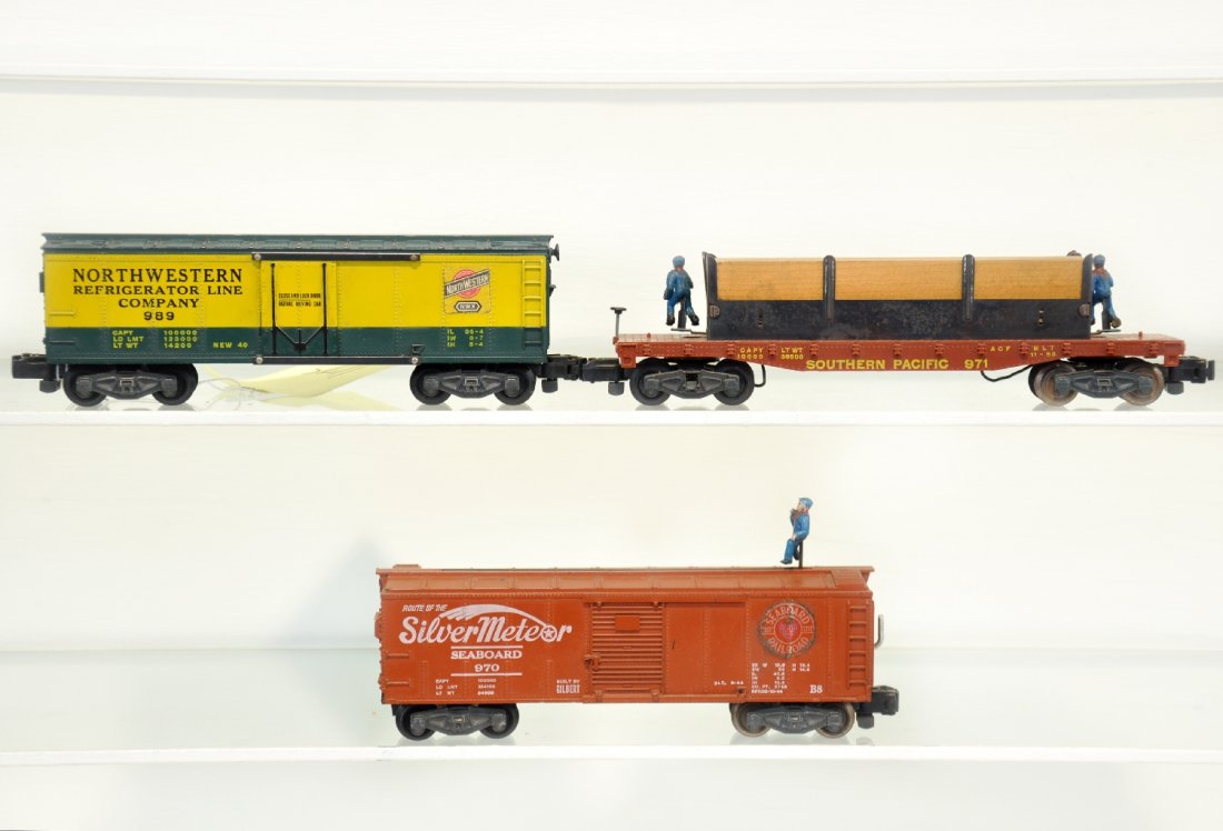 American Flyer 971, 989 & 970 Freight Cars: S Gauge. Includes a 989 C&NW reefer; 970 Silvermeteor animated boxcar, ob; 971 "Mo & Joe" lumber unloading car. They are clean, showing light to moderate playwear, C7