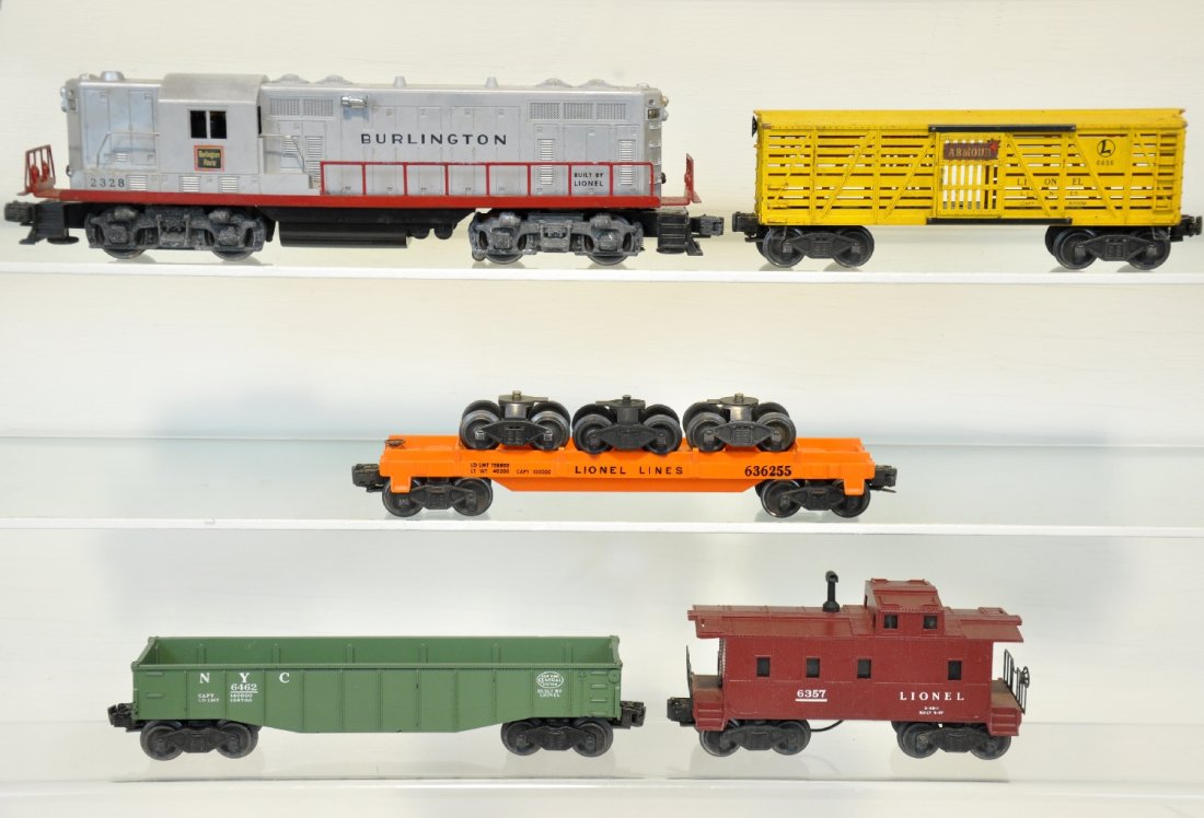 5Pc Lionel 2328 Diesel Freight Set: Includes a2328 Burlington GP9 diesel, nice lettering, silver is blotchy, battery box is clean; 6362 truck car, run load; 6462-25 gondola; 6656 stock car with armour decal; 6357 caboose. All show moder