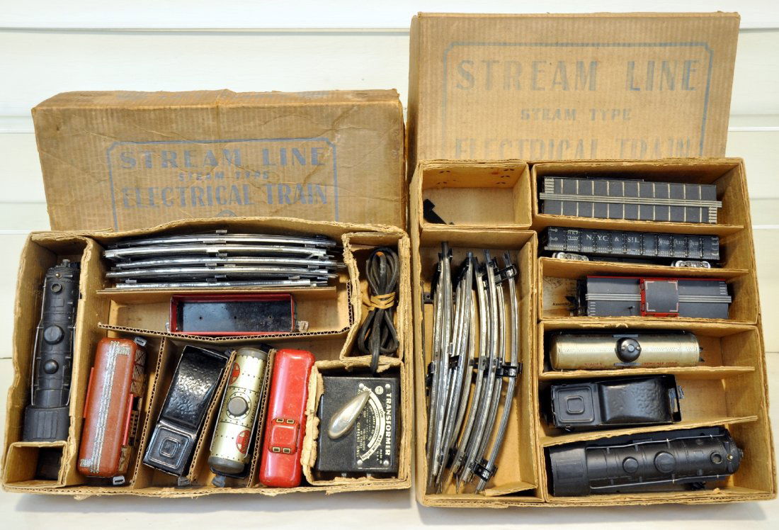 Boxed Marx 999 Sets 3987 & 25000: 25000 includes a 999 loco with wedge tender; gondola; boxcar; tank car & caboose; 39876 includes a 999 loco; wedge tender; stock car; tank car; gondola & caboose. Both have track & set boxes. Trains a