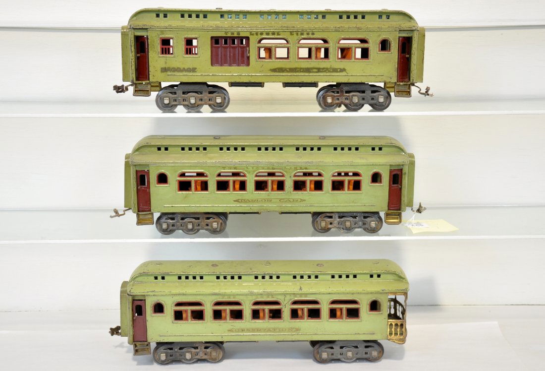 3 Lionel 418 Passenger Cars: Standard Gauge. Includes a 419 combine; 418 coach & 490 observation, all have red trim and missing some island glass inserts. They show moderate to heavy playwear, C4-5