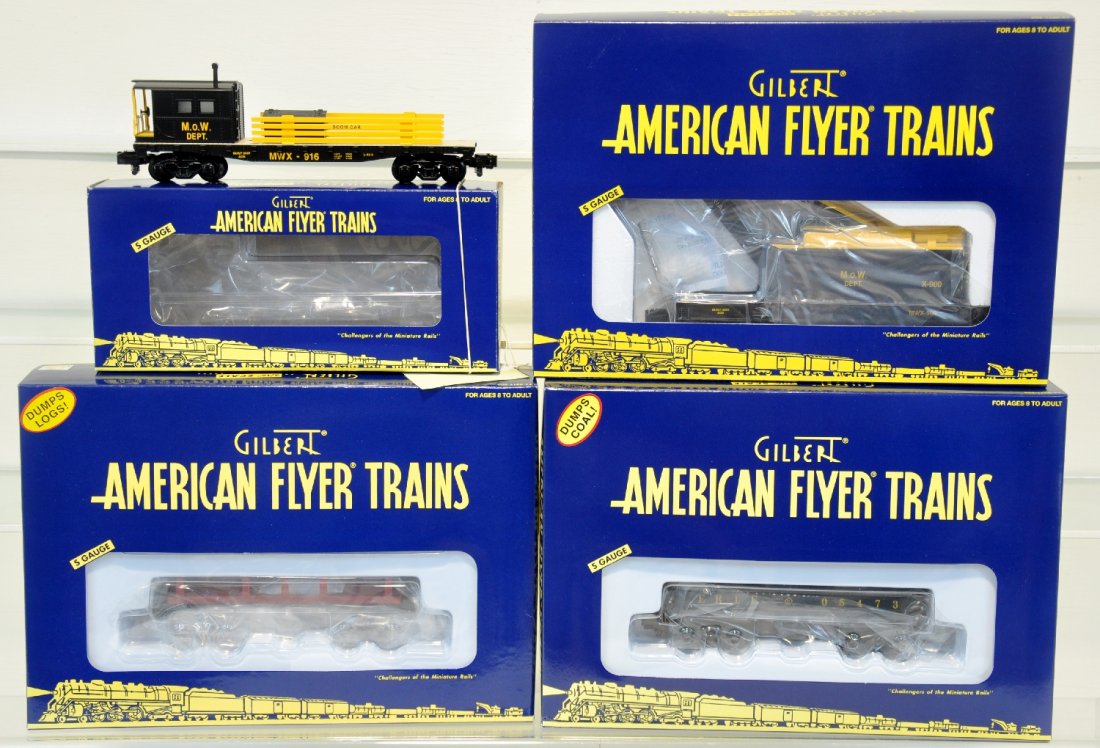 4 Pc Lionel American Flyer Freight Cars: S Gauge. Includes M.O.W. boom car 48740; Santa Fe log dump car 49039; Erie coal dump car 49042; M.O.W. crane car. All cars are unrun. Ob included. C10