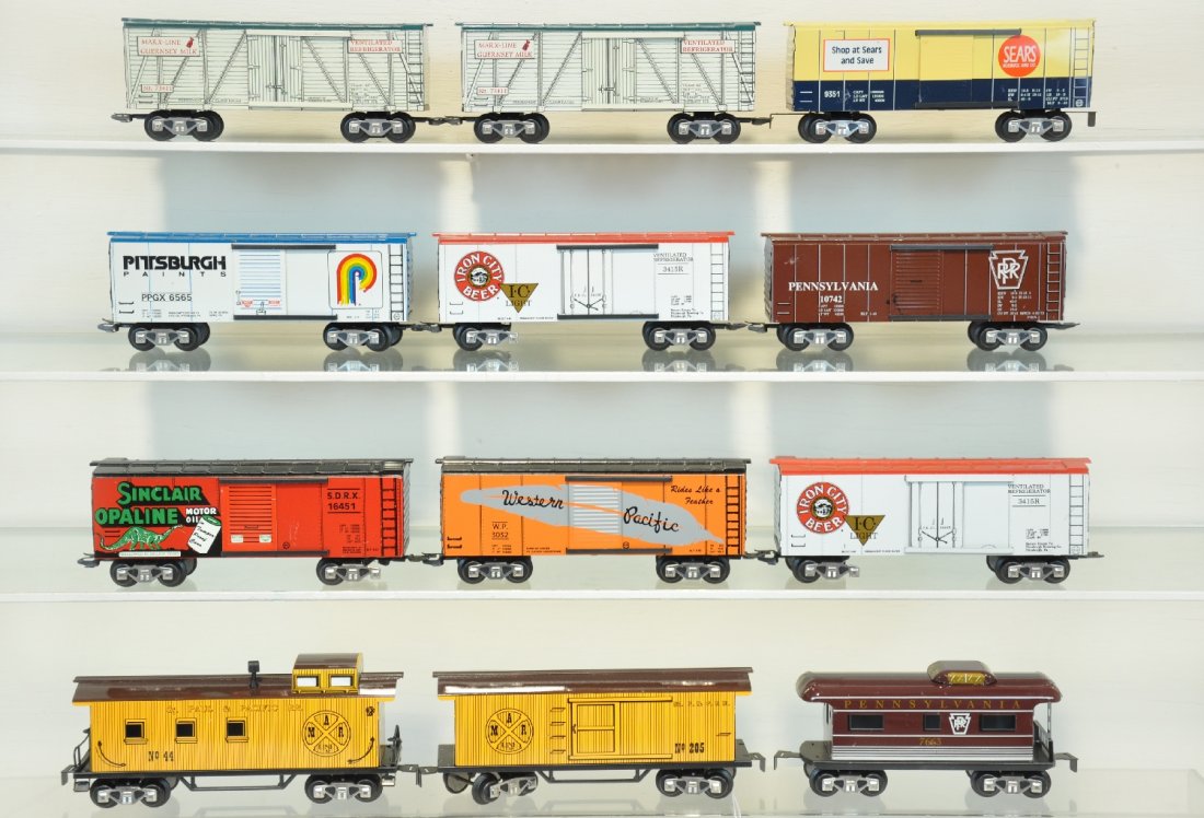 12 Modern Marx Freight Cars: Includes WP boxcar; Sinclair boxcar, missing wheel set; 205 boxcar; 44 caboose; PRR caboose; Sears boxcar; PRR boxcar; 2 Iron City Beer boxcars, missing 2 wheel sets; Pittsburgh paints boxcar; 2 gurne