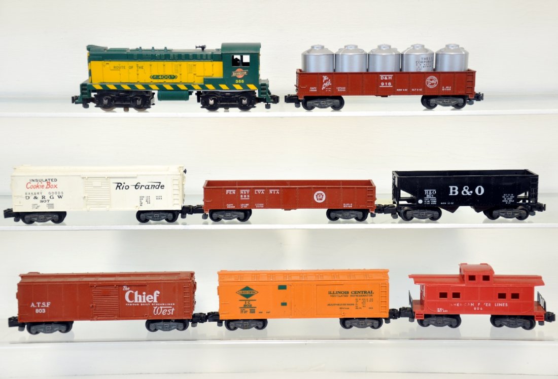 8Pc American Flyer Diesel Freight Set: S Gauge. Includes a 355 C&NW Baldwin, screw crack, but steps are intact; 803 SF boxcar; 801 B&O hopper; 802 IC reefer; 805 PRR gondola; 805 Cookie Boxcar; 911 gondola with canisters; 806 caboose, 1 br