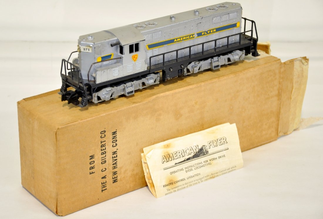 Boxed American Flyer 371 GM Diesel: S Gauge. Nice knuckle coupler variation. It is clean with 90% decals, instructions and box. It shows light to moderate playwear, C6+