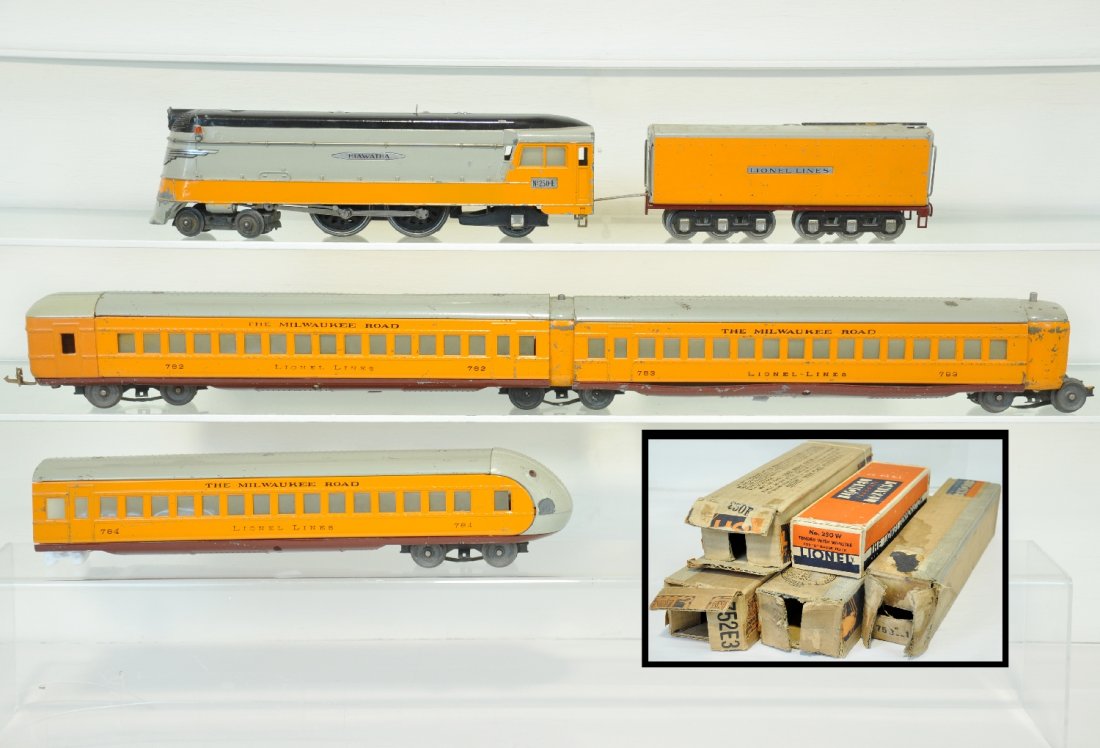 Boxed Lionel 250E Hiawatha Streamliner: 072. Circa 1937. Includes a 250E steam loco, strong castings, wheels turn, missing trailing wheel journal box; 250W whistling tender, missing coupler; 782 FE coach, replaced front casting; 2 #783 coac