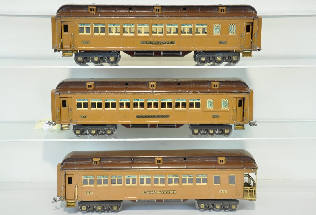 3 Lionel Brown State Cars: Standard Gauge. Includes a 412 Colorado Coach; 414 Illinois coach; 416 New York Observation. Cars have complete interiors, missing 2 roof latch pins. They are clean, showing moderate playwear, C5-6