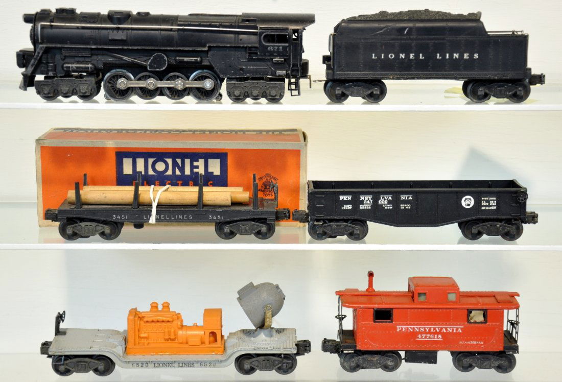 6Pc Lionel 671 Steam Freight Set: Includes a 671 turbine; 671W tender; 6520 searchlight car; 2452 gondola; 3451 lumber dump with worn box & insert; 2457 PRR caboose, missing 2 window inserts. All show moderate playwear, C5+-6