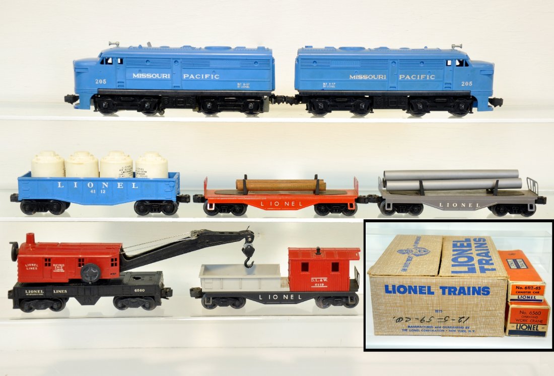 Boxed Lionel 205 Set 1575: Nice clean set including a 205 MP Alco AA diesels, cowls intact with metal supports installed; 6111 flat with logs; 6112 gondola with canisters; 6121 flat with pipes; 6560 crane with box; 6119-100 wor