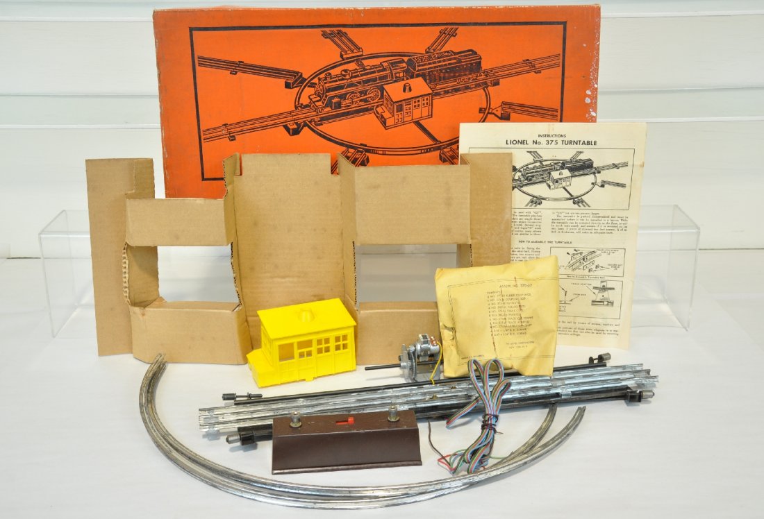 Boxed Lionel 375 Turntable: Appears unused, but has light oxidation spots from poor storage. It is complete with inserts. Box has paint spots one end, C6 ish