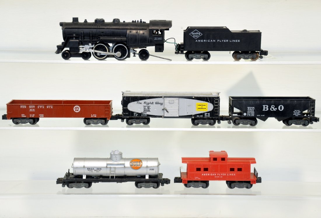 7Pc American Flyer Steam Freight Set: S Gauge. Includes a 21160 loco & tender; 24110 PRR gondola; 24203 B&O hopper; 24309 tank car; 24026 C of G boxcar; 24610 caboose, broken catwalk end. All show moderate playwear, C4-6