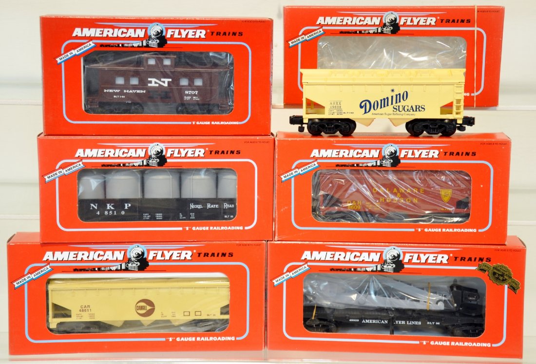 6 Lionel American Flyer Freight Cars: S Gauge. Includes 48611 Carail hopper; 49608 Domino hopper; 48510 NPR gondola with canisters; 48707 NH caboose; 48609 D&H hopper; 49009 flat with derrick, all new in boxes, C10