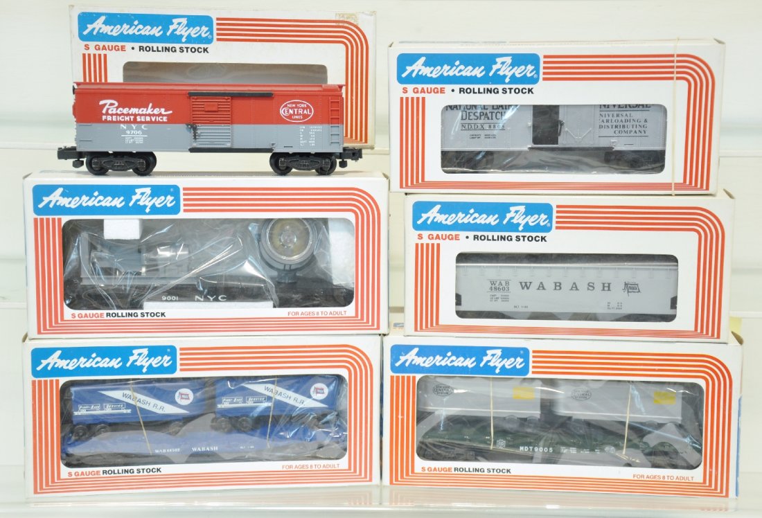 6 Lionel American Flyer Freight Cars: S Gauge. Includes 9706 NYC boxcar; 9005 NYC flat with vans; 49001 NYC searchlight; 48805 National boxcar; 48603 Wabash hopper; 48502 Wabash flat with trailers. All are unrun with boxes, C10