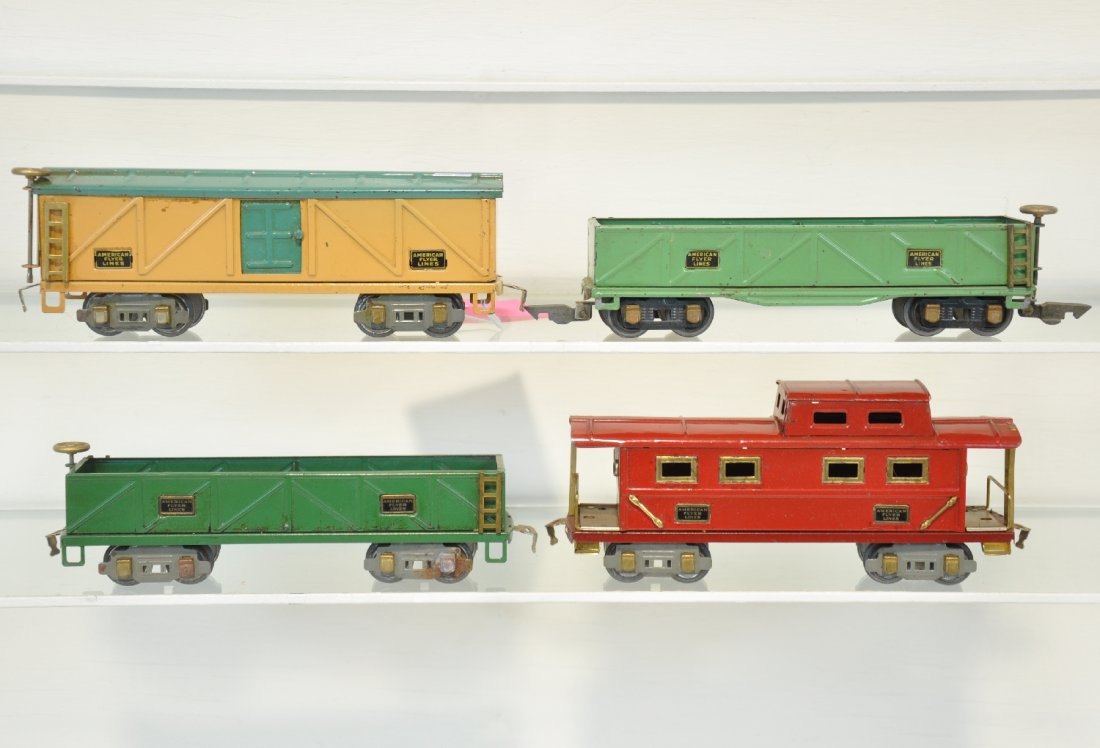 4 Clean American Flyer Freight Cars: Includes a 3207 sand car; 3208 boxcar; 407 sand car; 3211 caboose. All show light to moderate playwear, C6-7