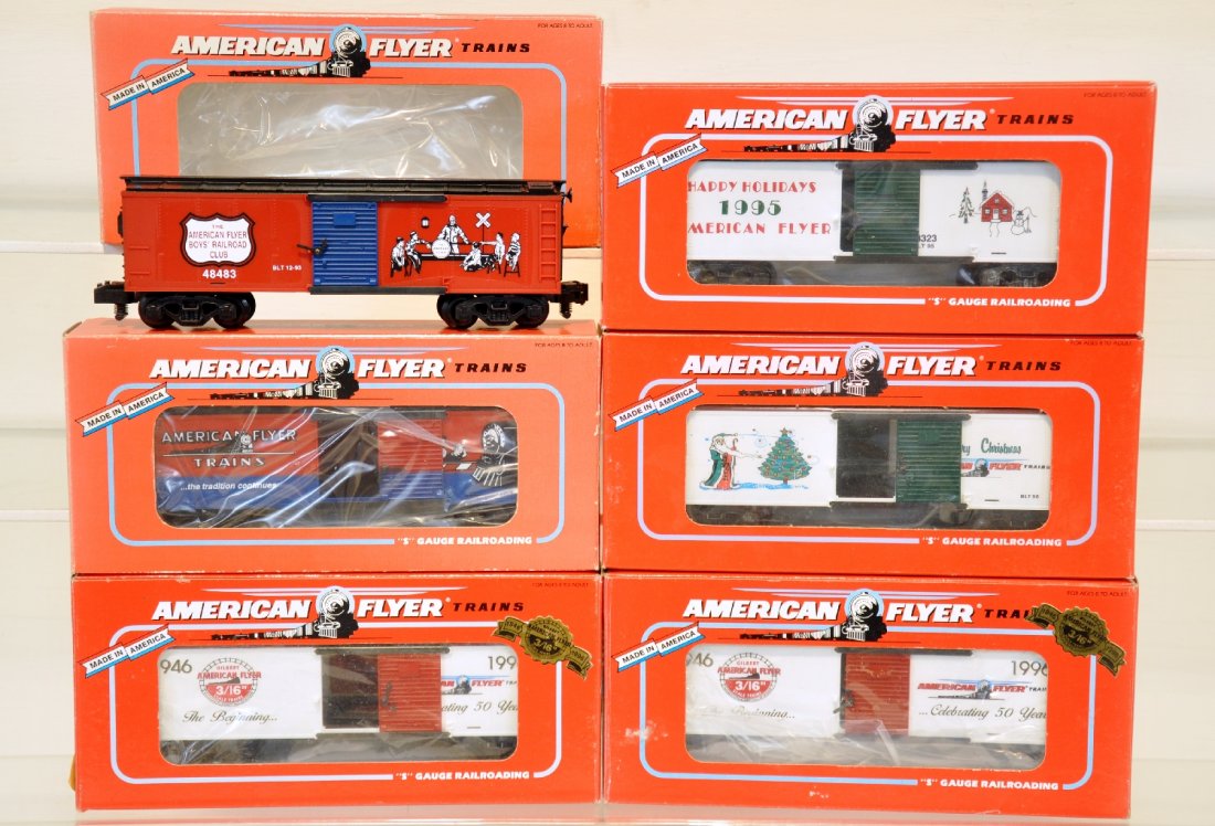 6 Lionel American Flyer Freight Cars: S Gauge. Includes 2 #48324 #1996 AC Gilbert; 48484 AF crossing gate boxcar; 48483 BRC boxcar; 48325 1996 Christmas boxcar; 48323 (1995) Christmas boxcar. All are like new with boxes, C9-10