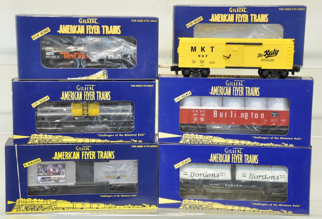 6Pc Lionel American Flyer Freight Car Lot: S Gauge. Includes M-K-T boxcar 48332, Angela Trotta Thomas boxcar 48389, tank car-tank train 48410, Burlington gondola 48525, Gilbert Chemicals tank car 48411, Borden's flatcar 48524. These cars are u
