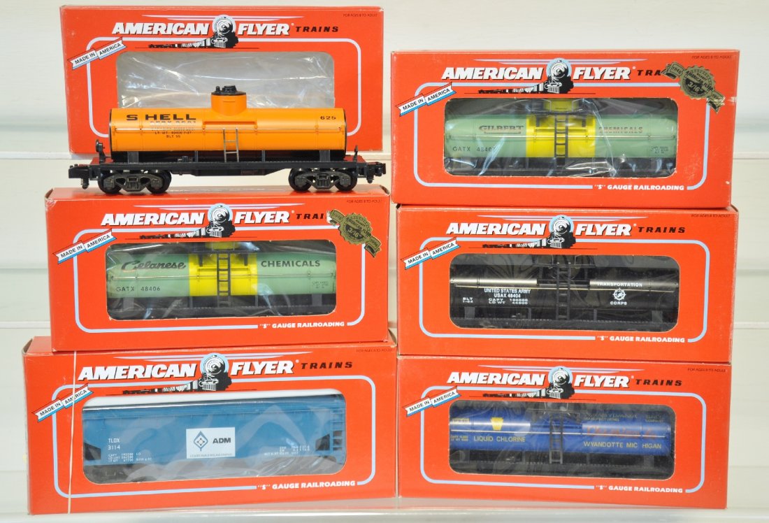 6 Lionel American Flyer Freight Cars: S Gauge. Includes US Army Tank Car 48404, Gilbert Chemicals tank car 48407, 950 ADM hopper 48612, Shell tank car 48405, Penn Salt tank car 48402, Celanese Chemicals tank car 48406. These cars are unru