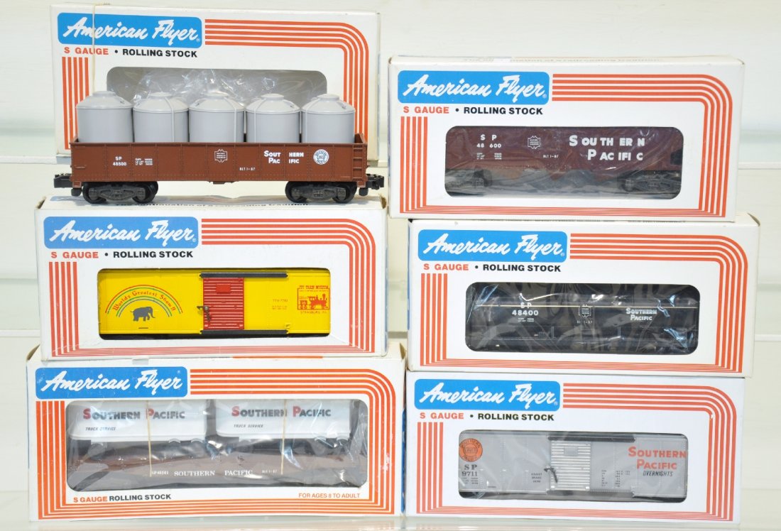 6 Lionel American Flyer Freight SP Cars: S Gauge. Includes 48500 gondola with canisters; 48400 3d tank car; 48600 hopper; 9711 boxcar; 48501 flat with trailers; plus a 7783 TCA museum circus car. All are like new in boxes, C10