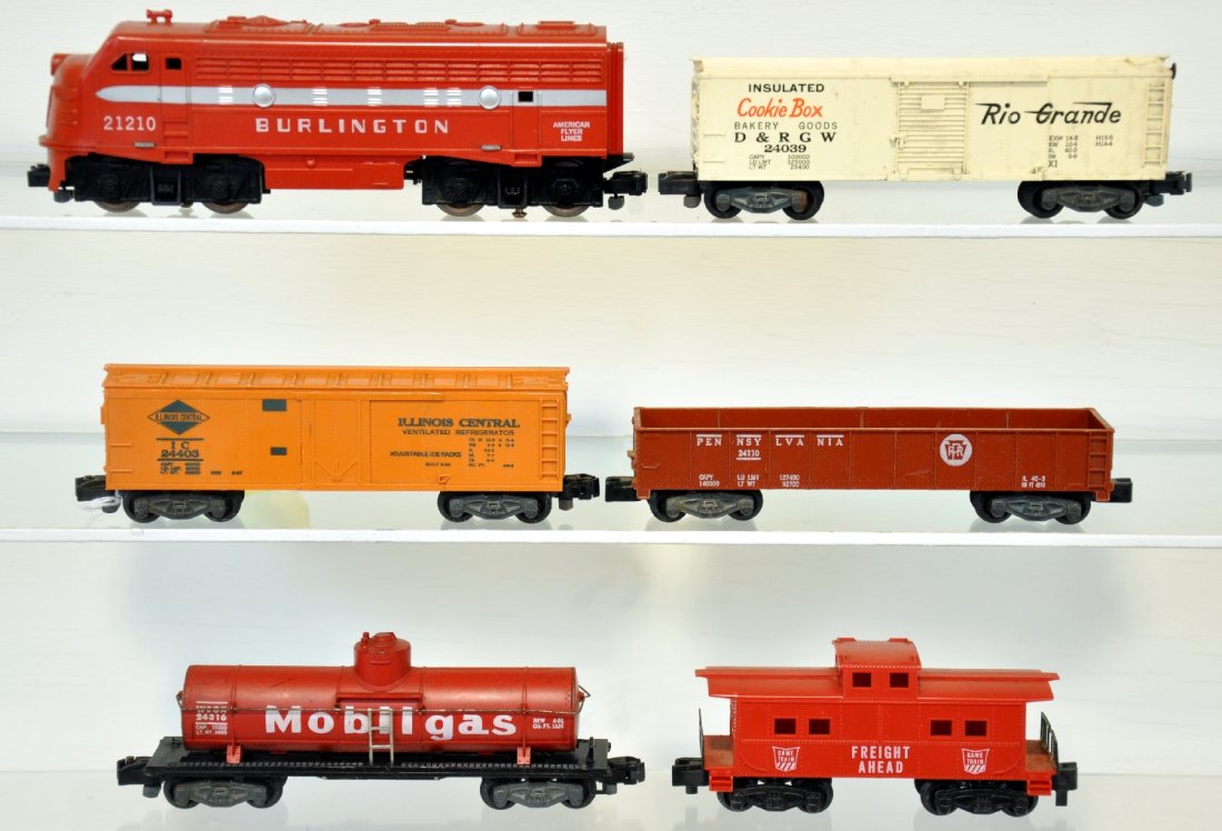 6Pc American Flyer Diesel Freight Set: S Gauge. Includes a 21210 Burlington F7 diesel, intact with nice lettering; 24316 Mobilgas tank car, 1 broken step; 24403 IC reefer, unpainted version; 24110 PRR gondola; 24039 Cookie boxcar; Game Tra