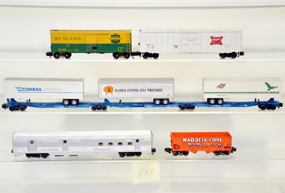 7Pc American Models Freight Cars: S Gauge. Includes an unlettered RPO; 3Pc Spine set with trailers; Reading boxcar; Waddell hopper & Miller beer reefer. They are dusty, but only show very light runtime, C8+