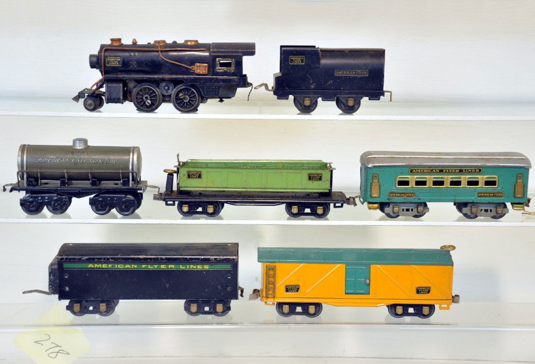 7Pc Pre War American Flyer Group: Includes a 1935 sheet metal steam loco with whistle, missing rods 1 side; tin vandy tender; 1118 tank car; 3208 boxcar, (C7); 3219 side dump car (C6+); 2179 coach; 1680T tender. Otherwise, all show mo