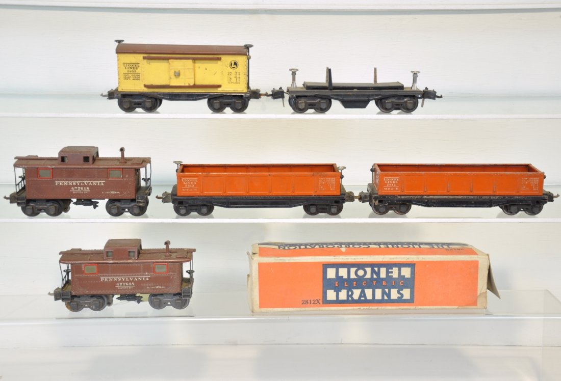 5 Pre War Lionel Freight Cars: Includes 2 #2812x gondolas, 1 rough ob; 3651 lumber car, missing 1 stake; 2655 boxcar; 2 #2752 cabooses. All show moderate playwear, C5-6