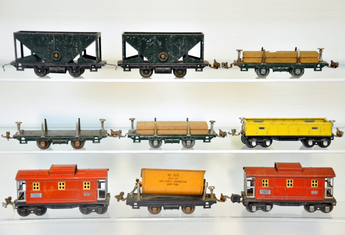 9 Pre War Lionel Freight Cars: Includes 3 #831 lumber cars, 2 loads; 809 tipple car; 2 #803 hoppers; 652 gondola; 657 caboose; 2657 caboose. Grade range is C4-6, so examine photos closely