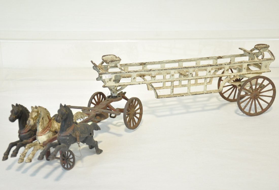 Carpenter 3 Horse Fire Ladder: Circa 1900. Painted cast iron, 32" long. It has nice castings, just missing the accoutrements. It show moderate playwear, C5