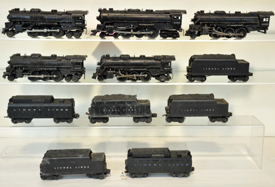 11Pc Lionel Loco & Tender Lot: Locos include 2018; 2065; 2 #2026; 2016. Tenders include 2466W, early flying shoe trucks; 6466W; 6026W, 2 broken steps; 2466W, mildewed; 6026T, broken steps; 2466WX. All show moderate to heavy playwea