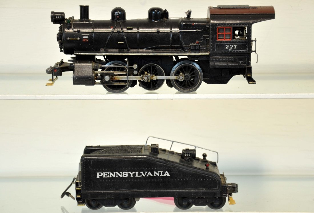 Modified Lionel 227 Semi-Scale Switcher: 227 B-6 switcher, scale style front coupler; 2227B slope back tender with postwar trucks. Redone with original tender lettering