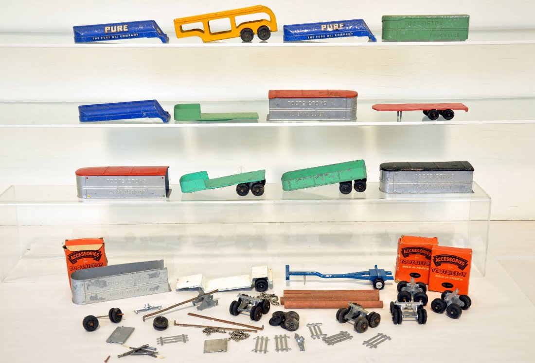 Large Group of TootsieToy Bild-A-Truck Parts: Includes 14 trailers, tops, wheel sets, even 3 boxed accessory sets with many parts; logs and more. Overall in average shape, C5