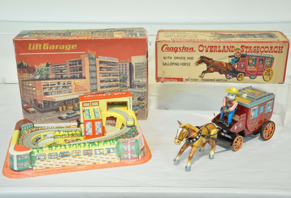 2 Boxed Vintage Toys: Includes a 14" Cragstan Overland stage battery toy. Mechanism functions with clicking sound and forward motion, like new, C9; Teknofix Lift Garage. Wind-up functions with 1 vehicle. It shows light to 