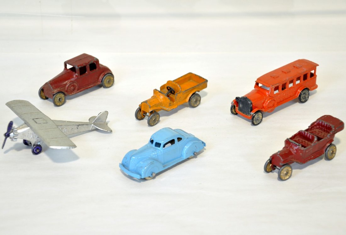 6 Pre War TootsieToy Vehicles: Includes a nice mono plane, C8; early Ford Tourer & Pick-up; Overland Bus, sedan & later coupe. Grade range C6-8, so examine photos closely