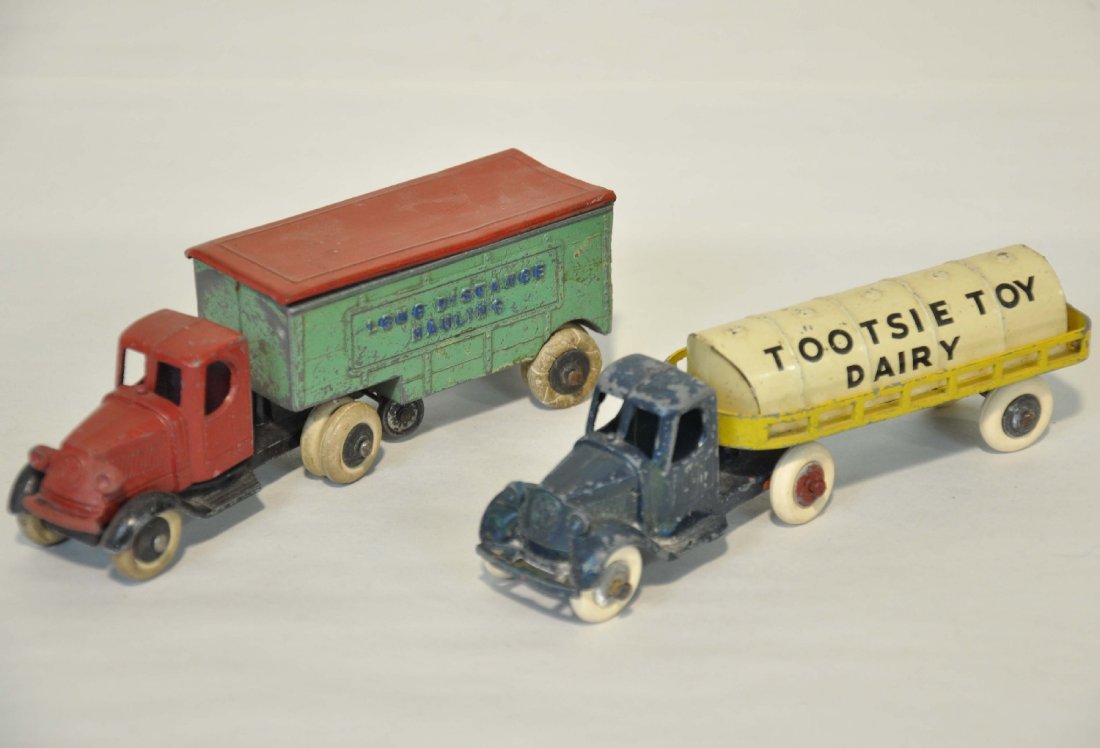 2 TootsieToy Mack Trucks: Includes a long distance moving truck & a dairy truck with replaced tires. They show moderate playwear, C5