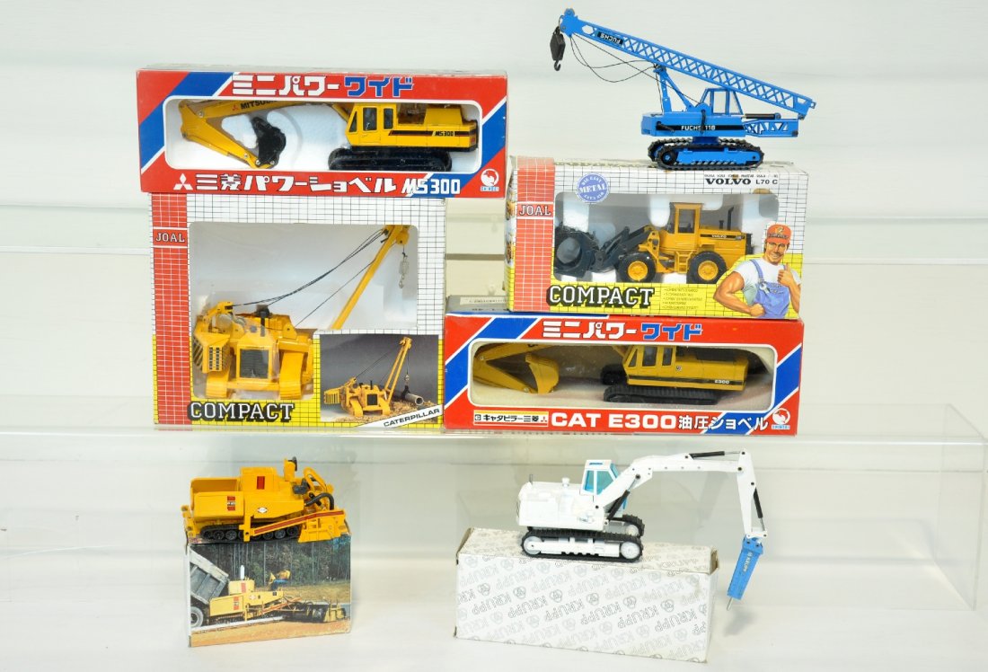 Boxed Scale Construction Vehicles: Include a Joal 224 1:70 C-596 pipe layer; Joal 235 1:50 Volvo log loader; Shinsei 1:48 Mitsubishi Hydraulic Excavator; Shinsei 606 Cat excavator; NZG Blaw Knox asphalt layer; NZG Krupp hydraulic jack 
