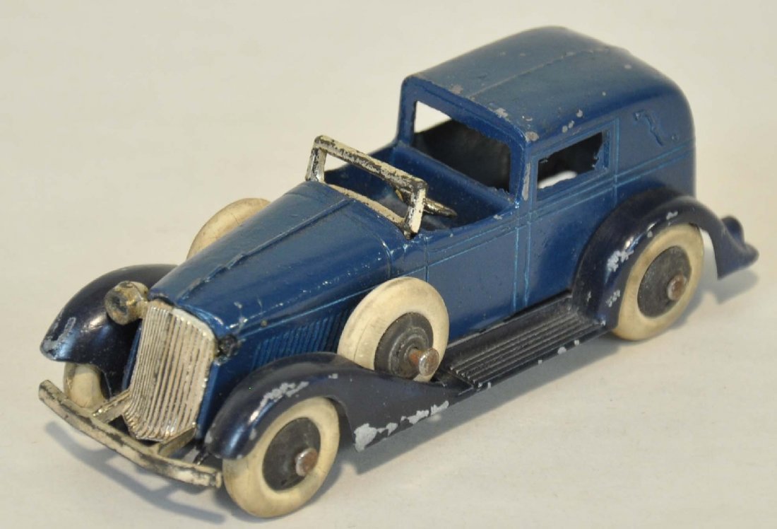 TootsieToy Graham Limousine: Nice two-tone limo with side mount spare tires. It is missing 1 headlight, otherwise shows moderate playwear, clean C6