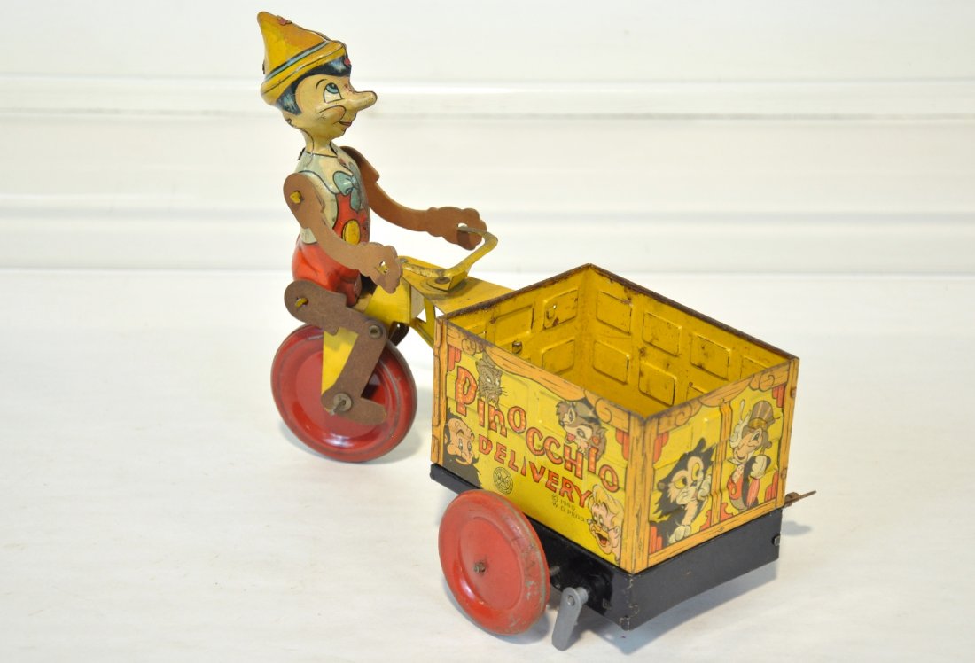 Scarce Marx Pinocchio Delivery Cycle: Dated 1940. Litho tin, 9" long with functional mechanism. It is fairly clean, showing light to moderate playwear, C6+-7
