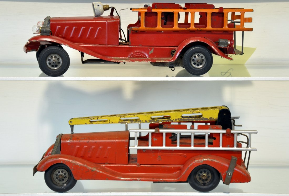 Girard Fire Ladder & Water Tower: Painted pressed steel, each 15" long, water tower has replaced ladders. Both mechanisms function, ladder truck's siren is untested as couldn't wind enough to properly test. Battery head, tail light & 
