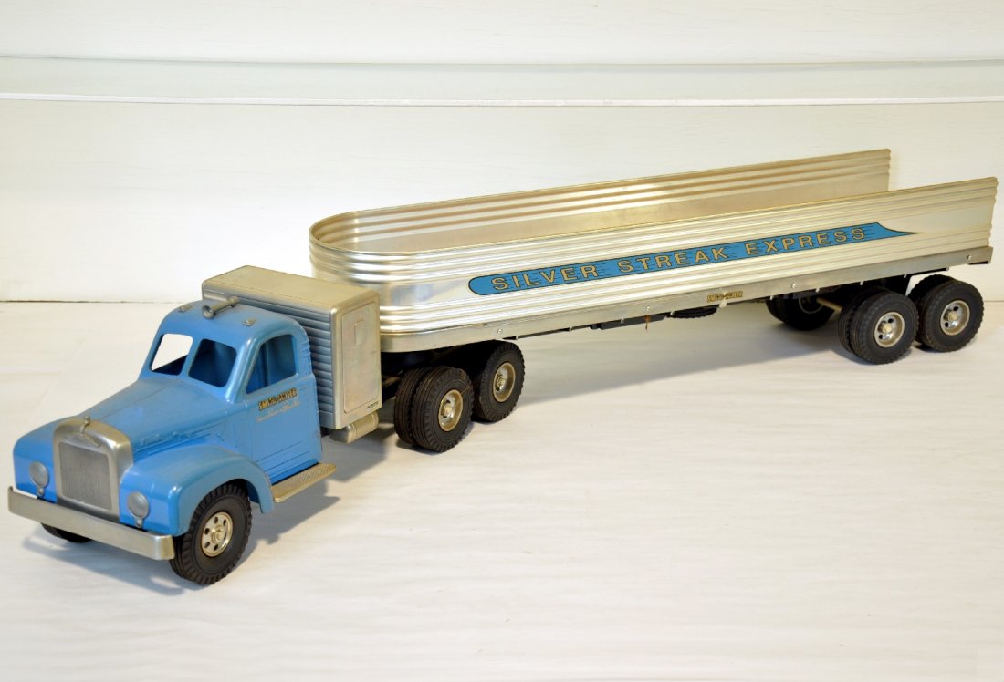 DeSalle STYLE Smith-Miller Mack Truck: Nice modern production of Smith-Millers Mack. This is the Silver Streak Express. Painted diecast & wood with rubber tires, overall 37" long. Shows very light wear, C8+-9
