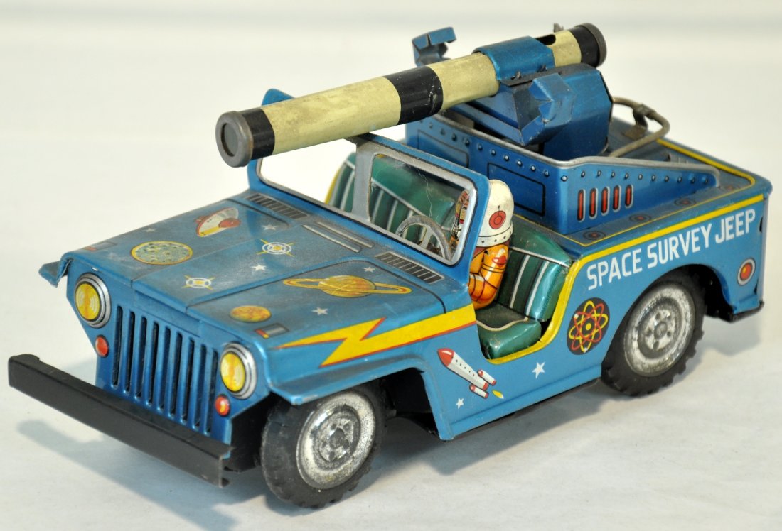 Rare Toymaster Space Survey Jeep: Cool Japanese litho tin jeep, 7" long with astronaut driver. Mechanism functions with swiveling cannon action, no flint for sparkler. It shows light to moderate playwear, C7+