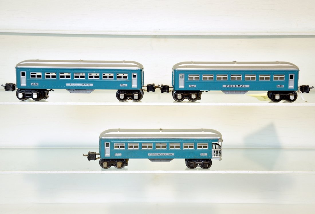 3 Lionel Passenger Cars: Includes 2 #2640 Pullmans; 2641 observation. They are clean with 1 small oxidation spot with 1938 unshielded pick-ups, observation has black journals and a 92 gray fishbelly. Otherwise they show moder