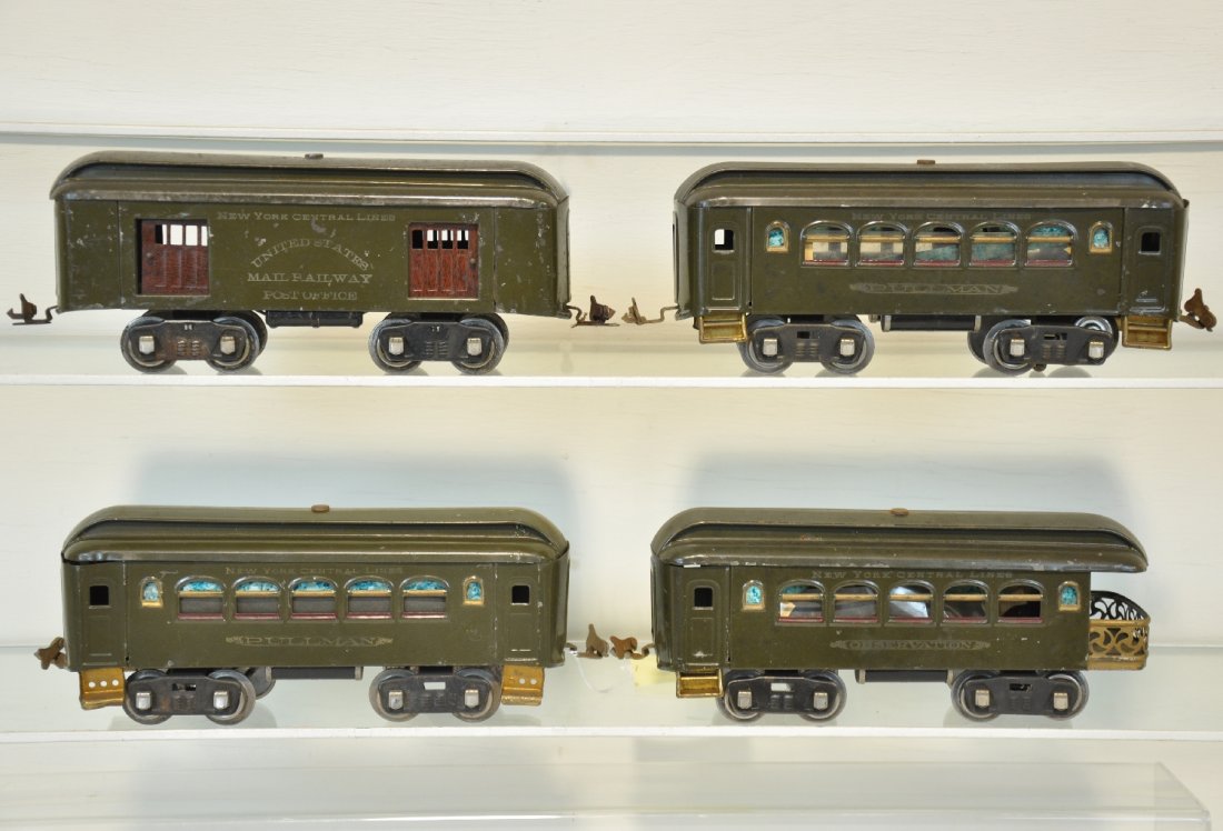 4 Early Lionel Passenger Cars: Standard Gauge. Includes a 32 baggage; 2 #35 Pullmans & a 36 observation. Will go great with a 33 or 50 loco. They have nice lettering and show light to moderate playwear, C6+-7