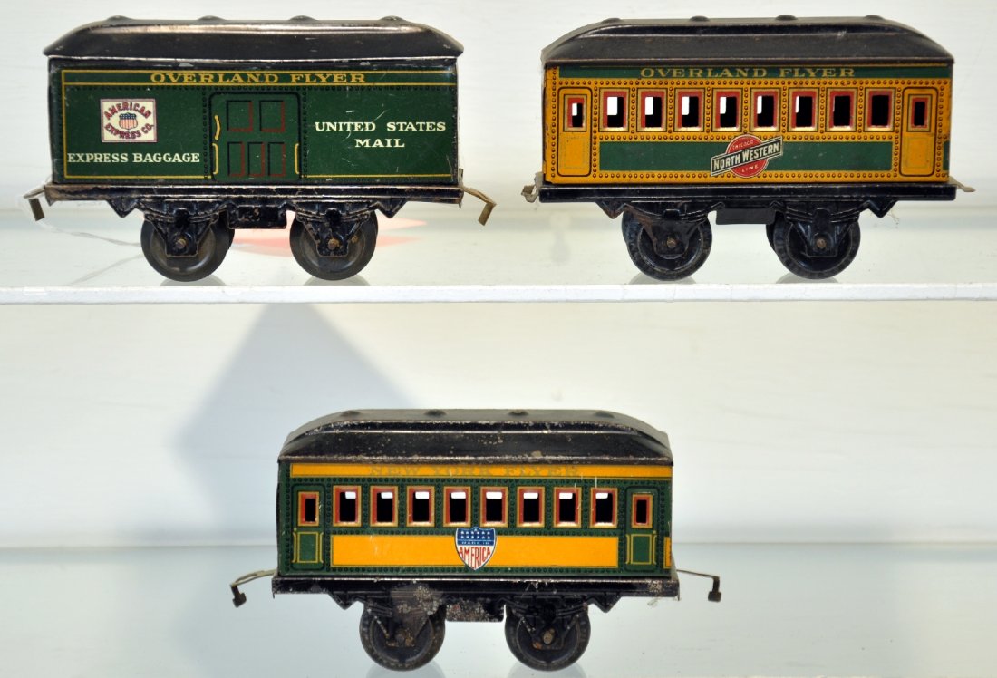 3 Nice Hafner Passenger Cars: Includes an Overland Baggage; C&NW coach & America coach. They are clean & shiny, showing light to moderate playwear, C6-7