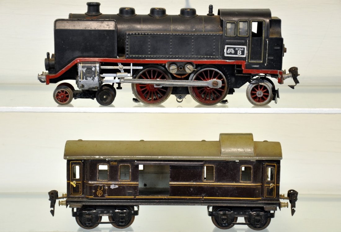 Scarce Marklin 70/12020 & 17590: O gauge. Includes a 70/12020 4-4-2 tank loco; missing 1 windscreen. 2 pony wheels have been replaced; 17590 Rheingold Postal car, missing 1 door. They show moderate playwear, C6