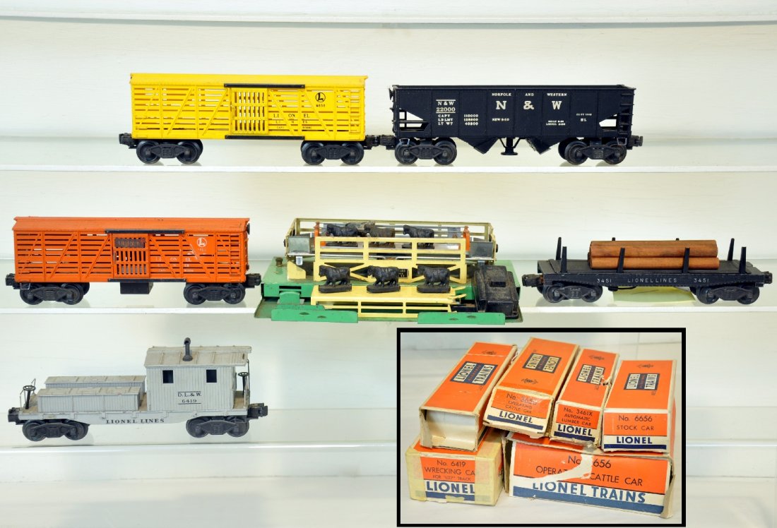 5 Boxed Lionel Freight Cars: Includes a 3656 cattle car & pen with accessories; 6656 stock car, C8; 3461X lumber dump car; 6419 work caboose, cracked, C5; 3456 N&W operating hopper, C7+. Otherwise all show moderate playwear, with
