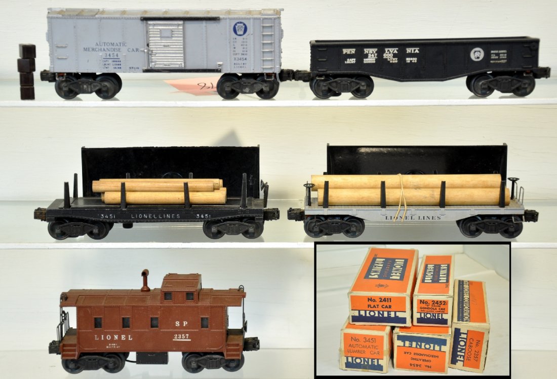 5 Nice Early Lionel Freight Cars: Includes a 2411 flat with logs; 3454 merchandise car with 4 cubes & bin; 2357 caboose; 2452 gondola; 3451 heat stamped lumber car with load & bin. All show light playwear with boxes & some inserts, C7
