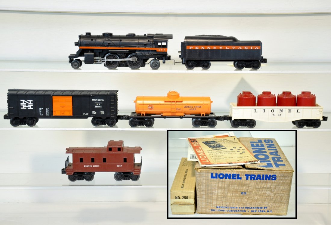 Nice Boxed Lionel Set 1573: Circa 1958 loose pack set. Includes a 250 Steam loco, ob; 250T PRR tender; 6025 Gulf Tank Car; 6464-425 NH boxcar, type IIB; 6112 Gondola with canisters; 6017 caboose, includes track & transformer and
